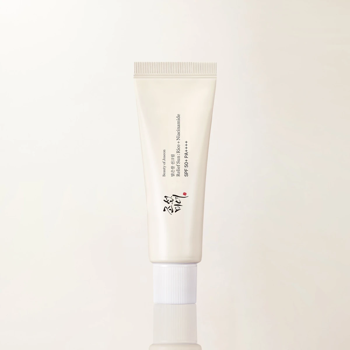 Beauty of Joseon Relief Sun Rice + Niacinamide SPF50+ PA++++, a cream-coloured tube with a white cap, front view